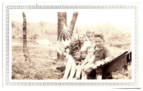 1934.. - clockwise from left - unknown, Eileen, Robert, Howard, cousin Eleanor, Jane.. - the hammock behind the cottage.jpg